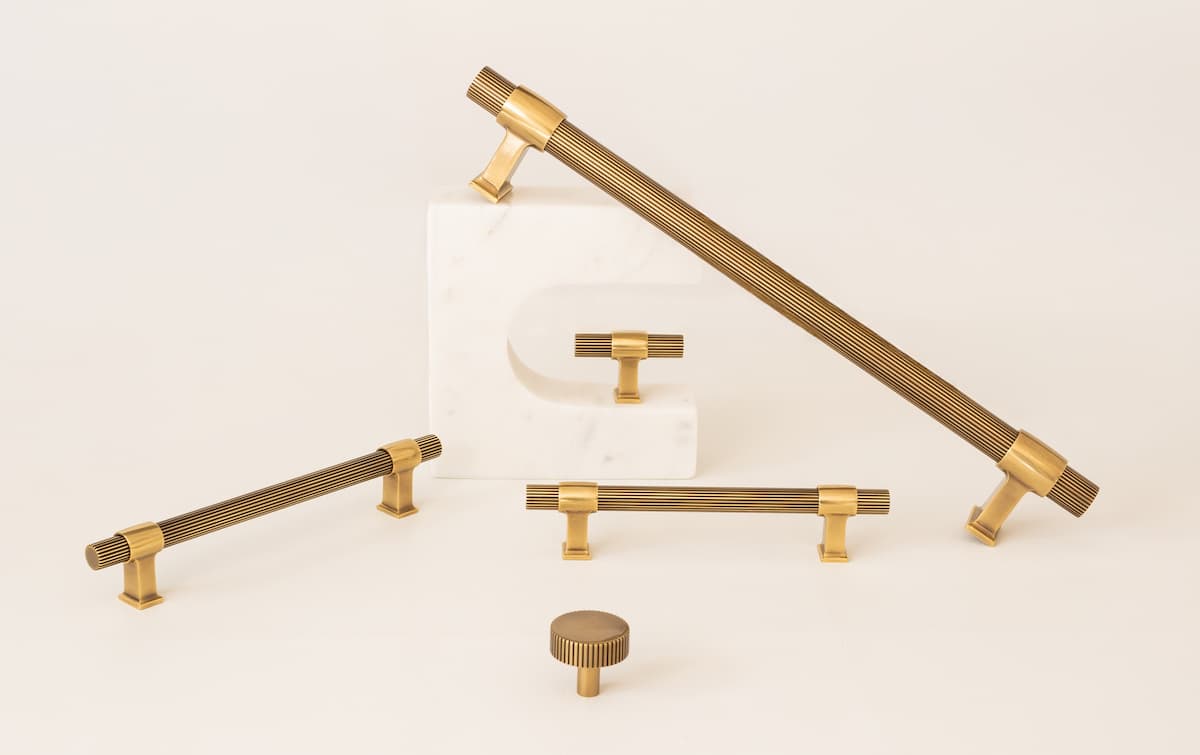 Selection of long, rounded cabinet pulls from Keeler Brass, with mixed gold and brass metals