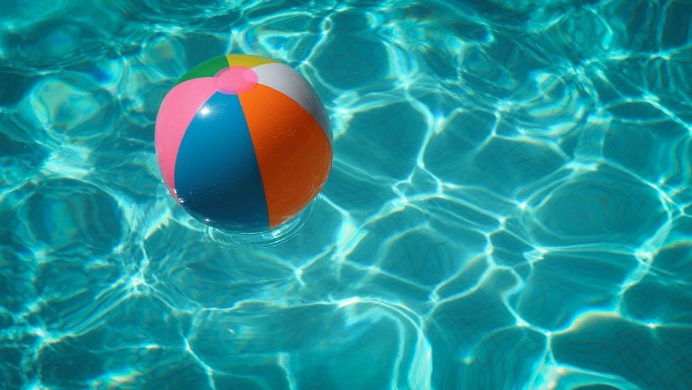colorful-beach-ball-floating-in-a-pool