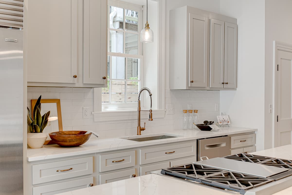 Neutral kitchen with example of kitchen triangle design and gas stove