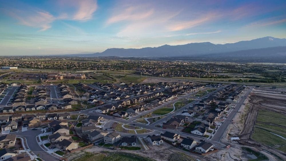 Aerial view of a sprawling suburb with lots of greenspace.
