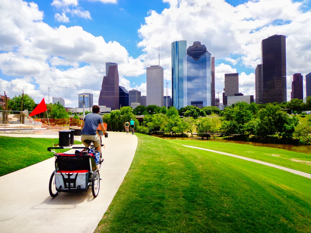 riding bike in Houston with skyline in the background