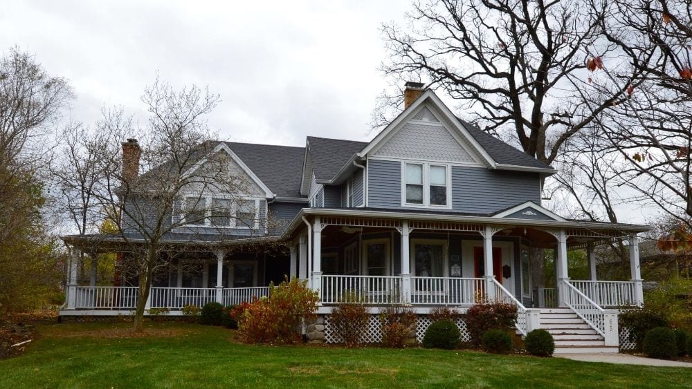 large Victorian home with wrap around porch