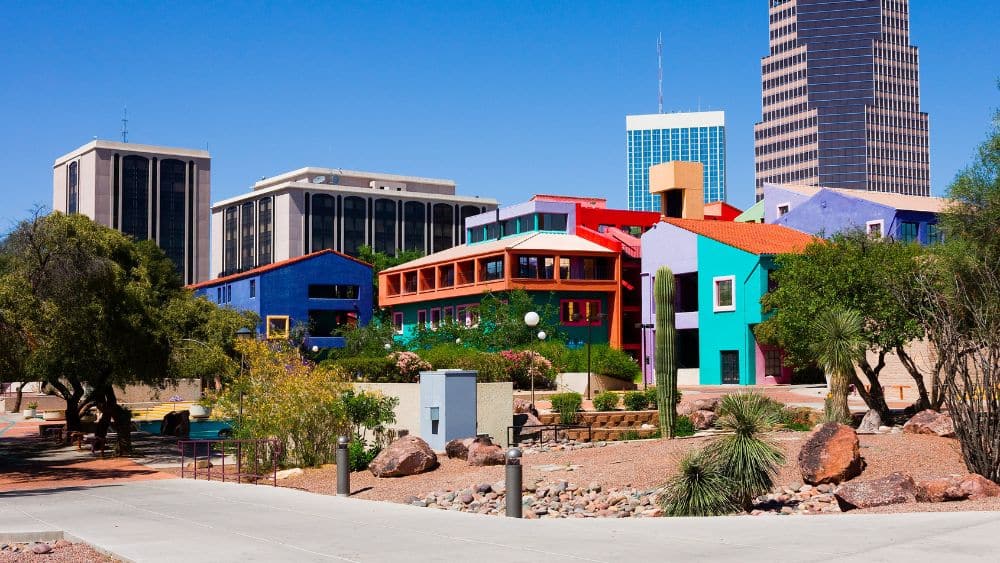 Tucson skyline with colorful houses in the foreground