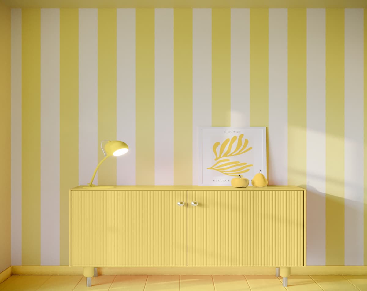 Wide stripe butter yellow wallpaper with yellow chest of drawers