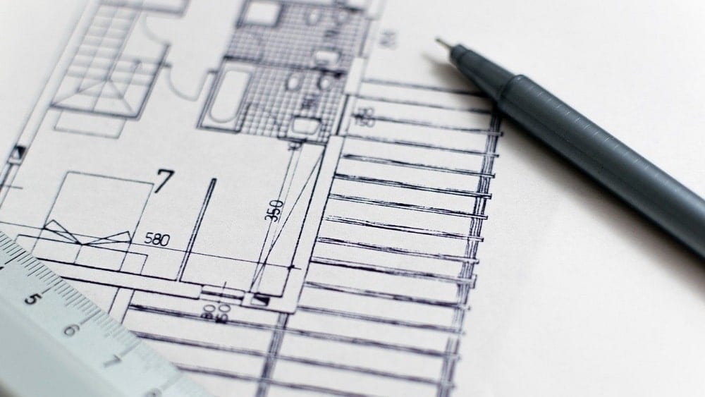 close-up of blueprint with pen
