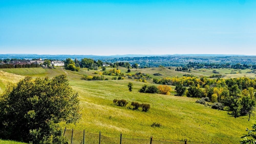 Open fields in North Dakota against a blue sky