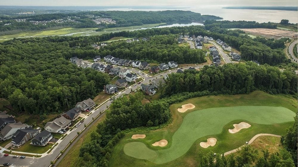 Aerial view of a suburban community with a golf course.