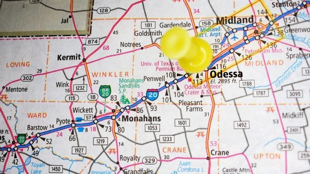 A road map of Texas with a yellow pushpin over Odessa, Texas.