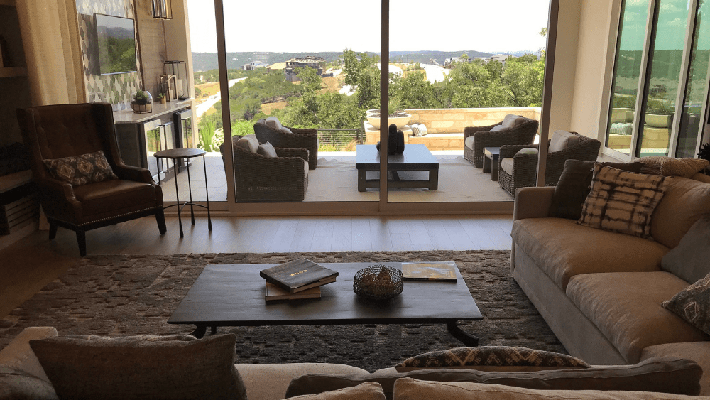 The living room at the Toll Brothers model home, which looks over the outdoor kitchen and patio area.