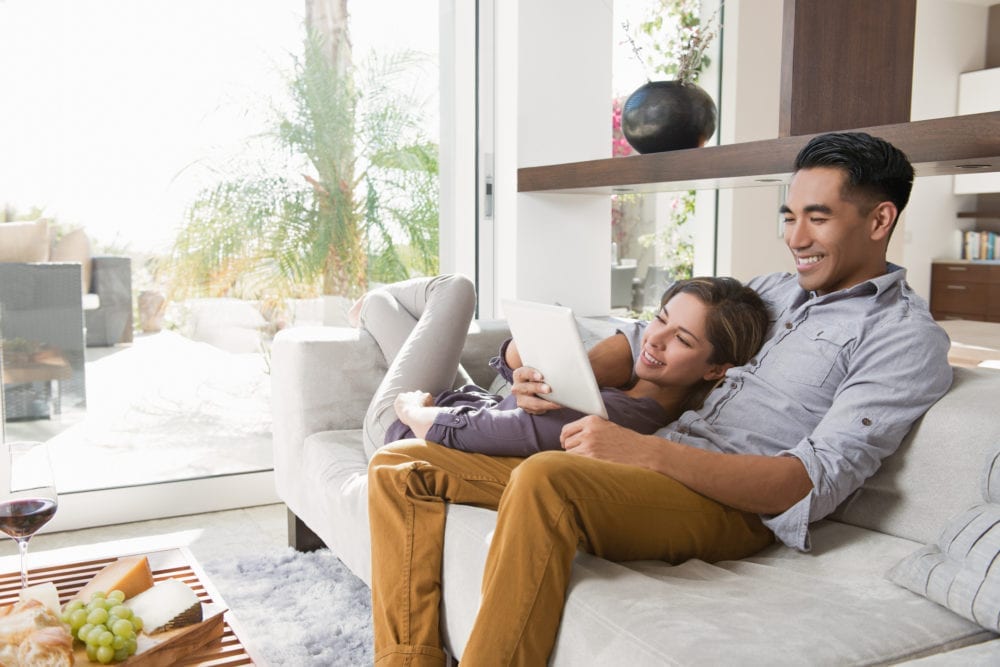 couple-looking-on-tablet-for-design-ideas-online