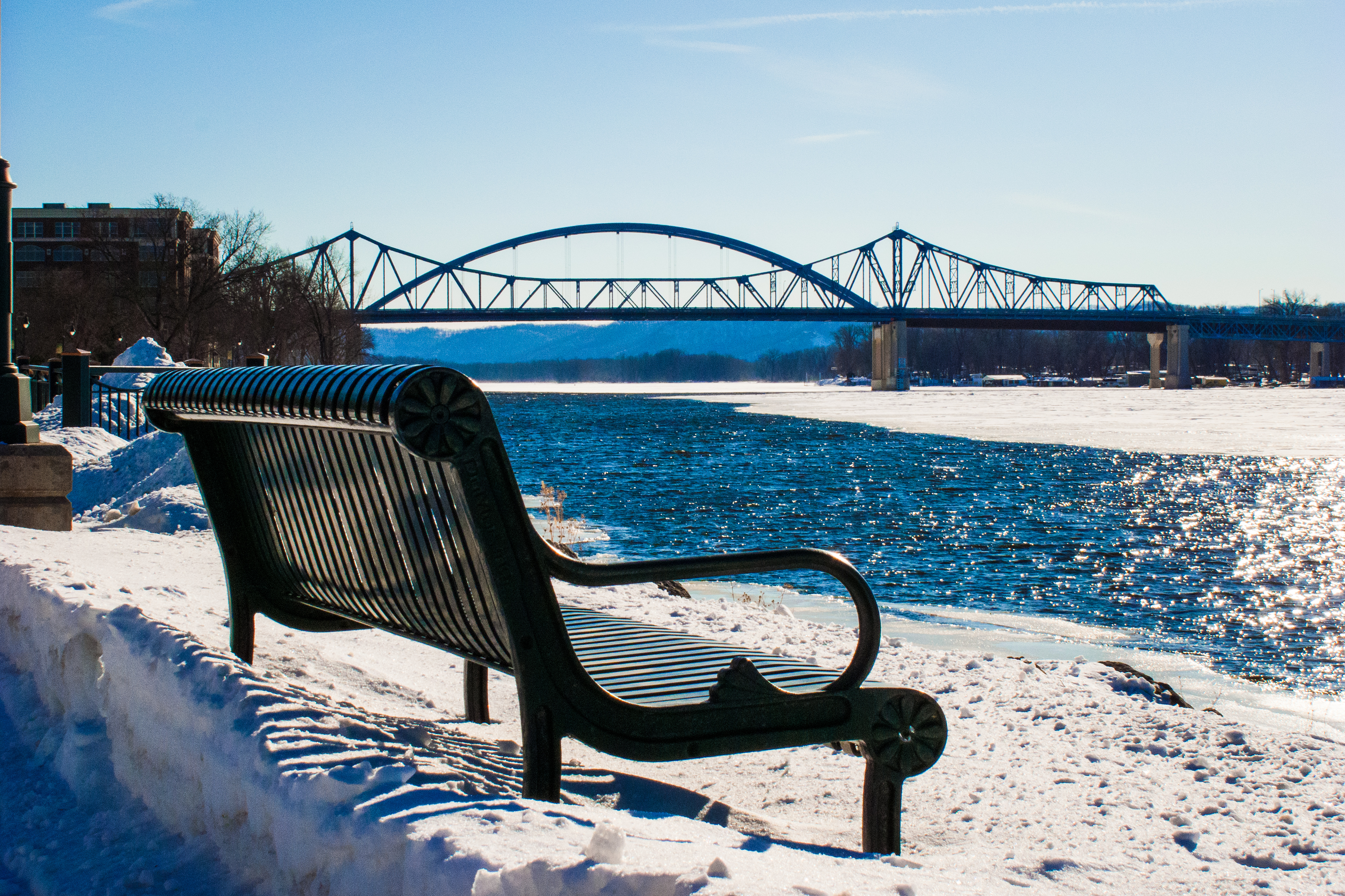 Bench overlooking bridge across the Mississippi River in Wisconsin near La Crosse