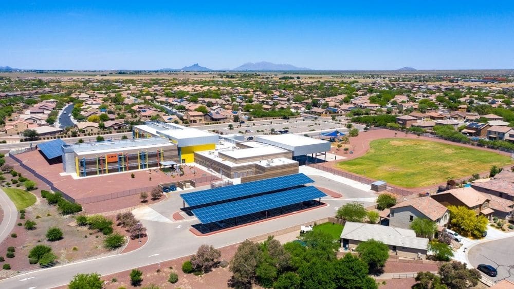 Aerial view of a suburban community with a recreational center.