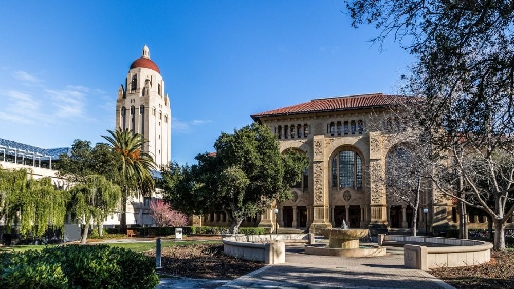 An administrative building and Hoover Tower on the University of Stanford’s campus.