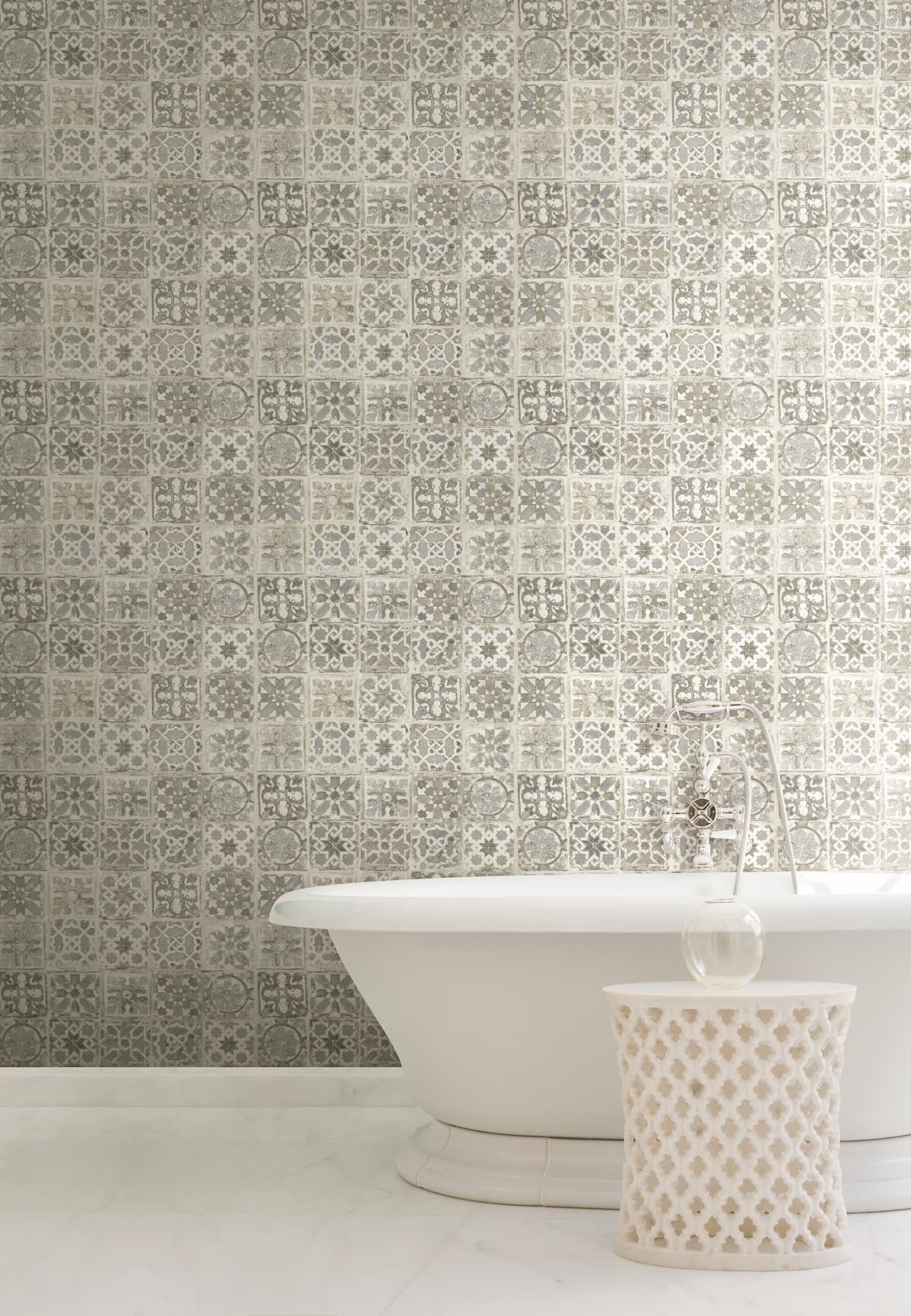 Blue mosaic wallpaper tile in a bathroom with bathtub