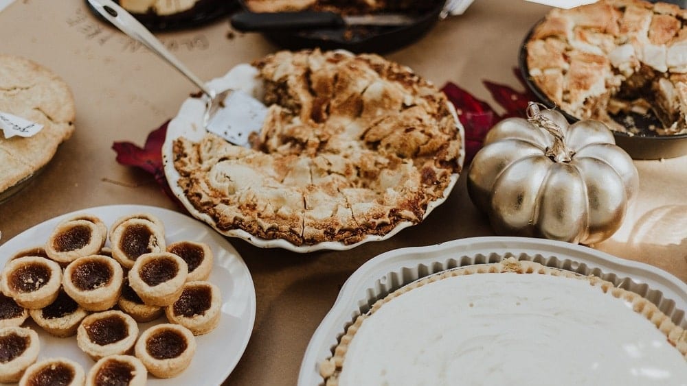 Pies and decor pumpkin on a table.