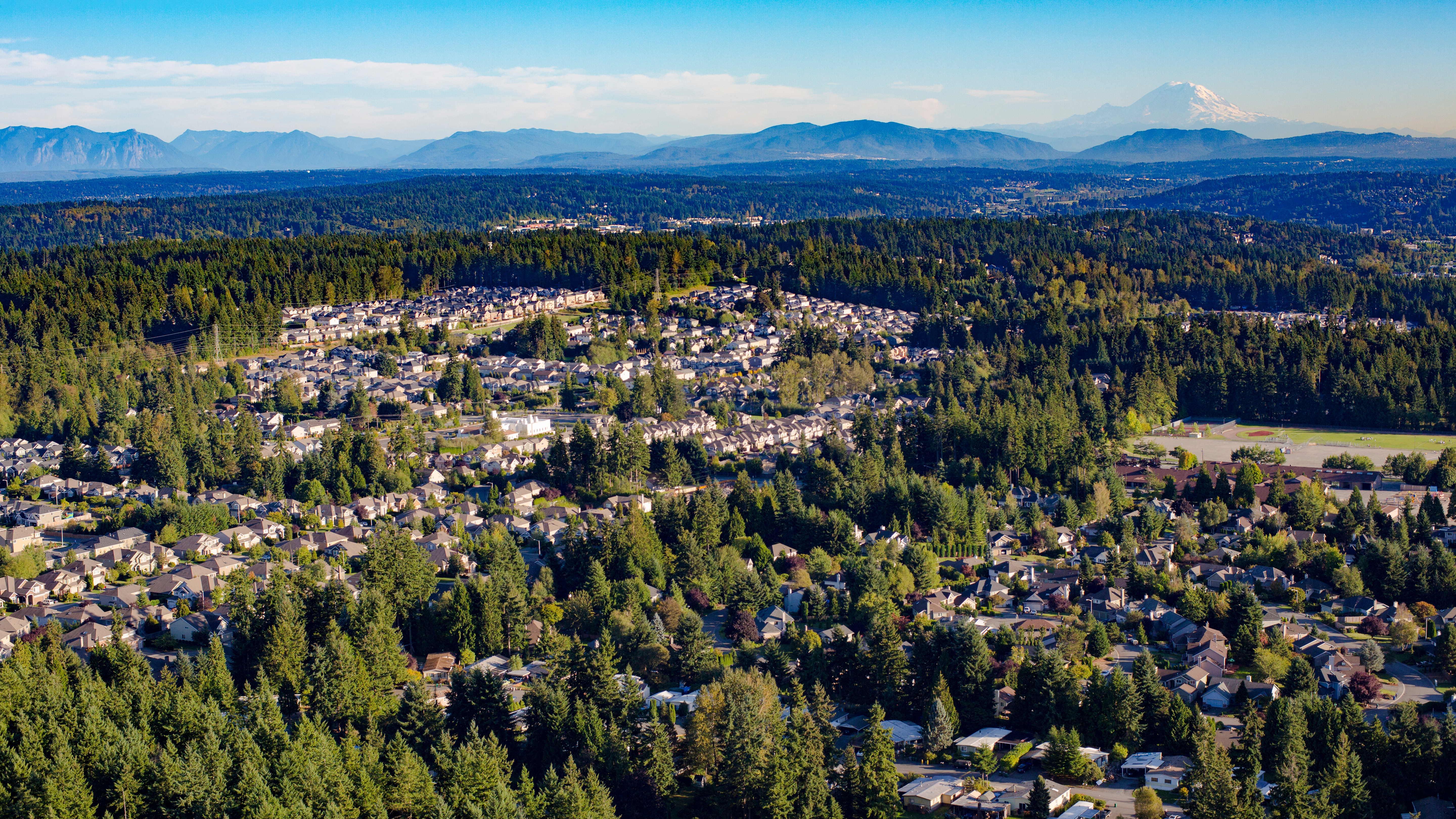 Aerial view of Bothell with Mount Rainier and Cascade Mountains in the background