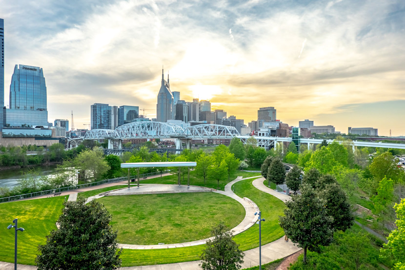 Nashville TN skyline, daytime on a cloudy day, with a park in the foreground