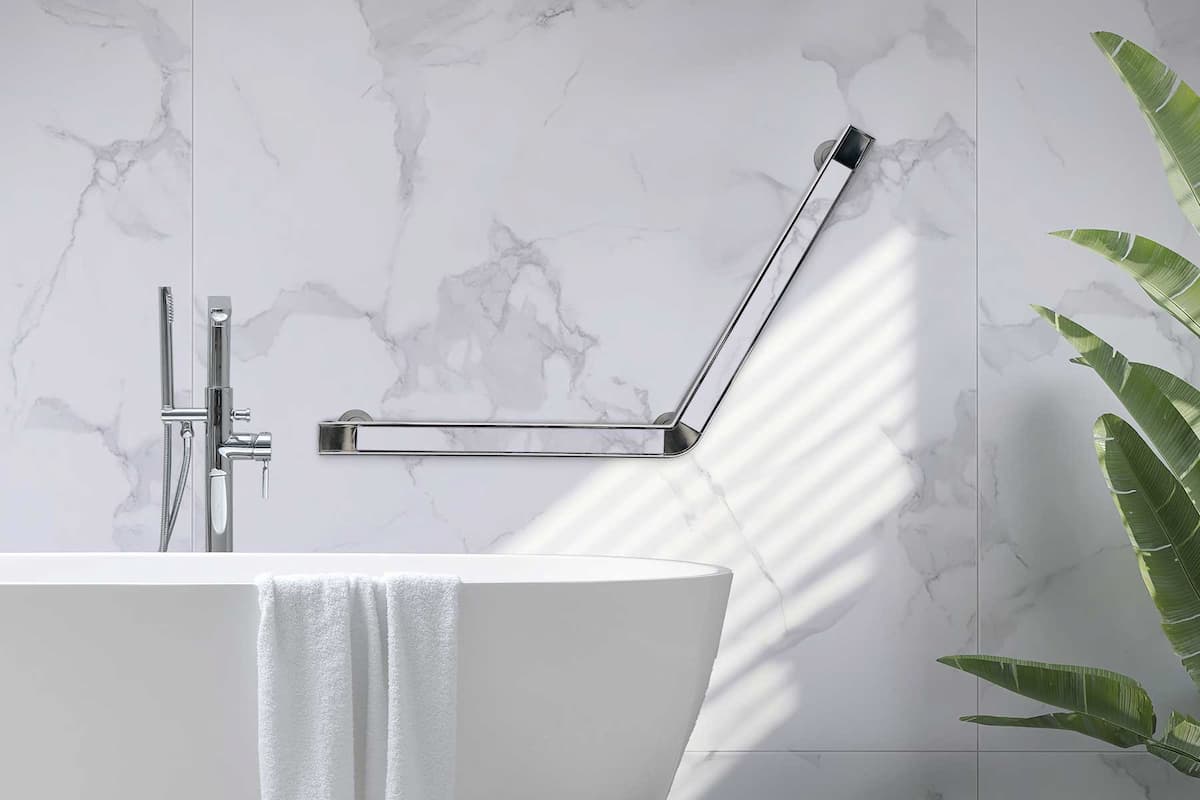 bathroom shot with stylish grab bar over an oval tub