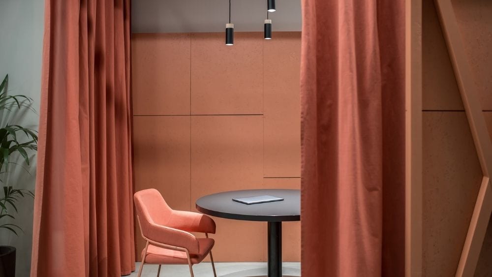 Curtains partitioning a study space.