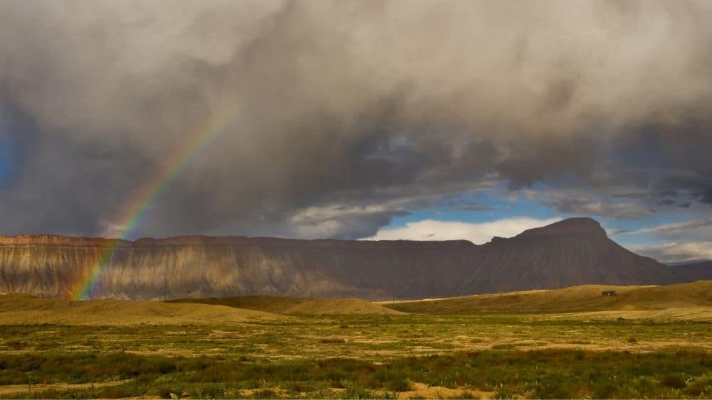 mountain-scape with rainbow and clouds