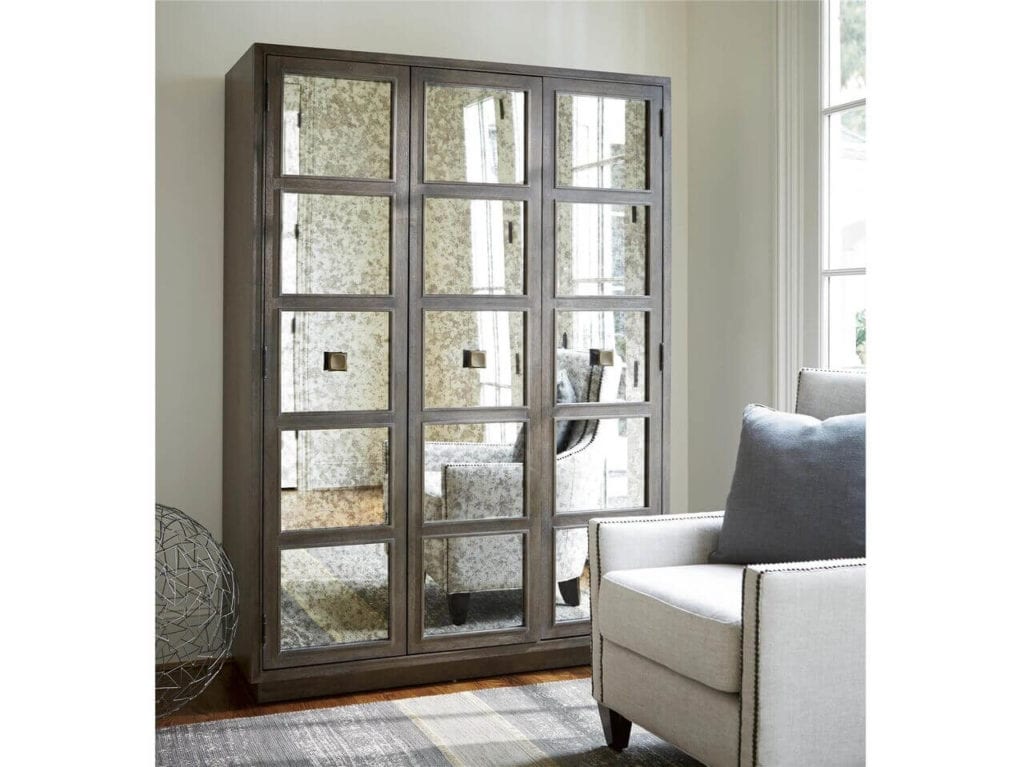 Mirrored wardrobe with medium brown wood finish from Universal Furniture.