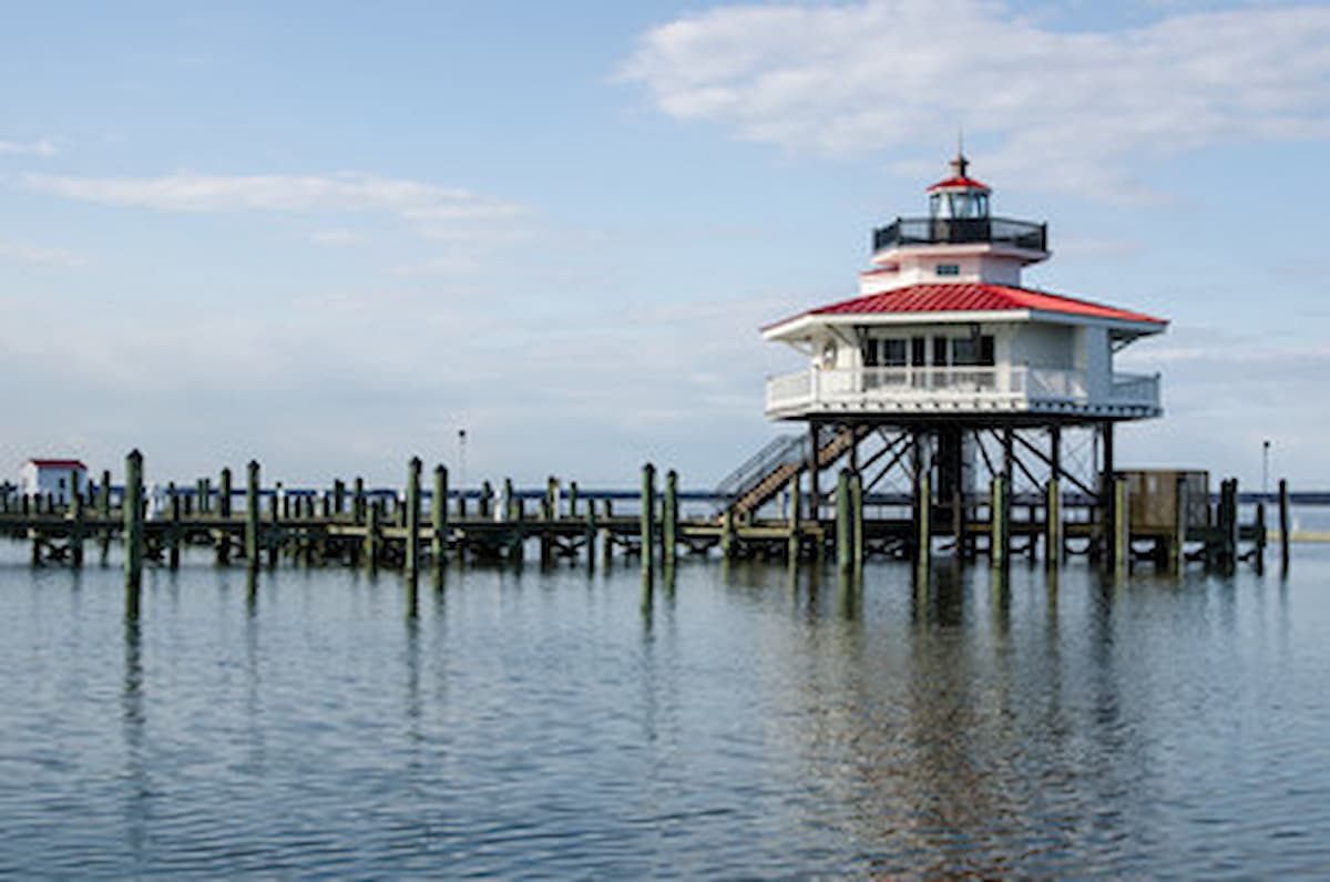 White short lighthouse near marina in Cambridge, Maryland