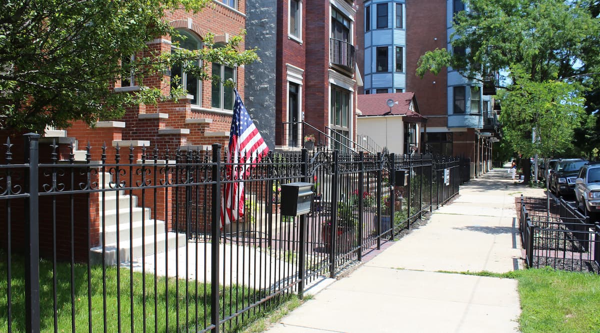wrought iron fenced front yards of a neighborhood street in West Town, Chicago neighborhood