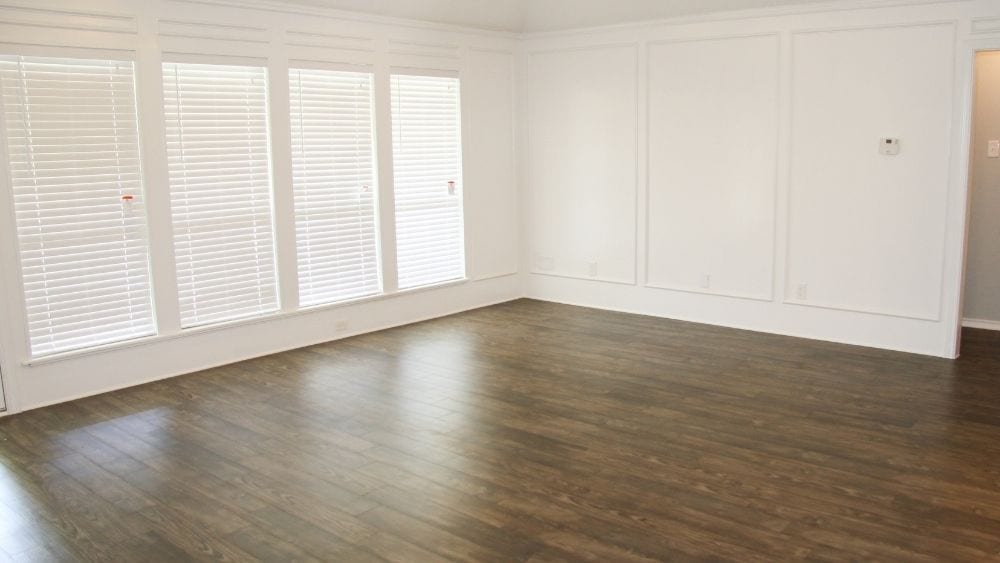 Empty room with vinyl flooring.