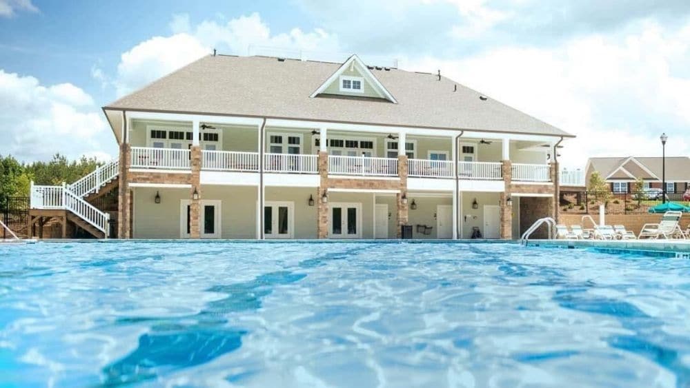 View from the pool looking up toward the two-story community center.