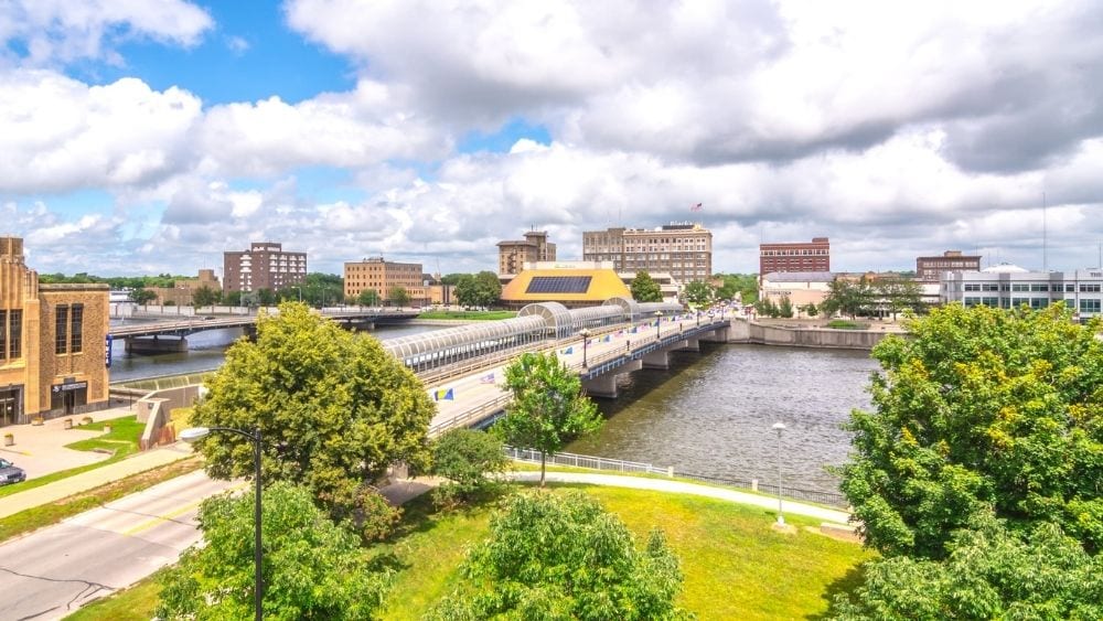 Aerial view of a bridge connecting two cities.