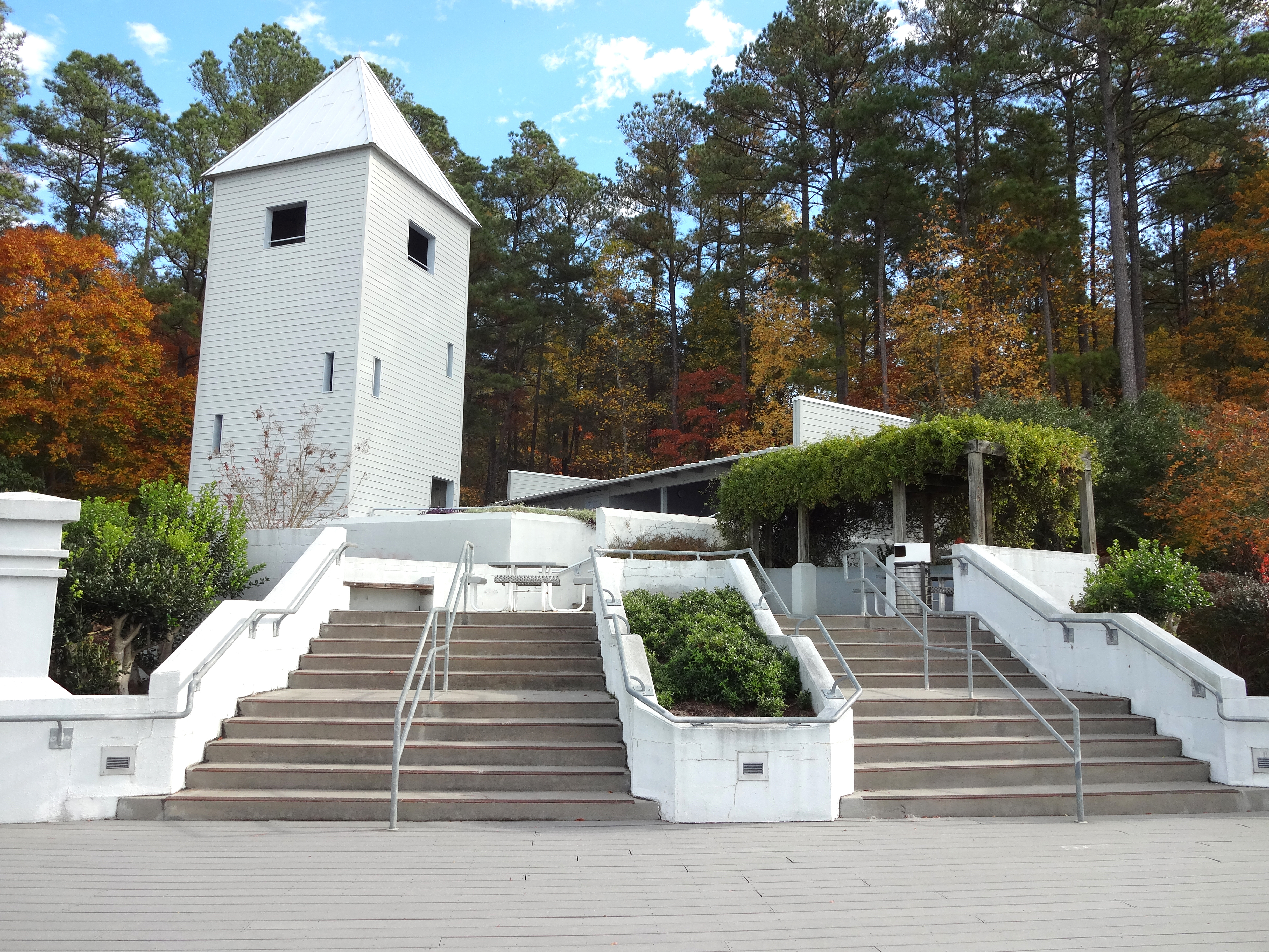 pavilion and tower in front of autumn foliage