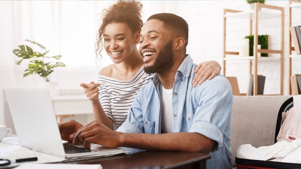 A couple looking at a computer screen