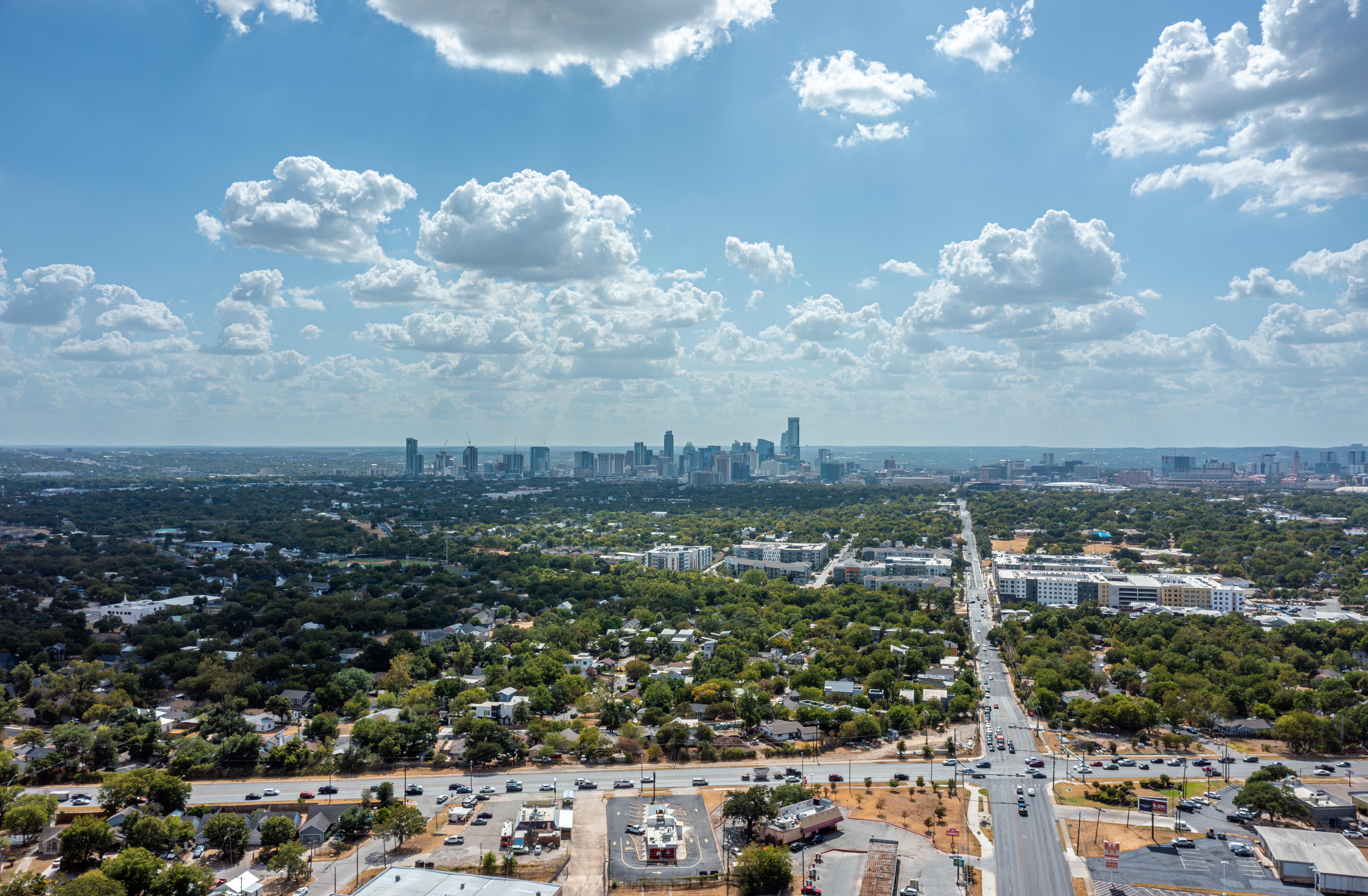 aerial view of neighborhood with downtown in the background