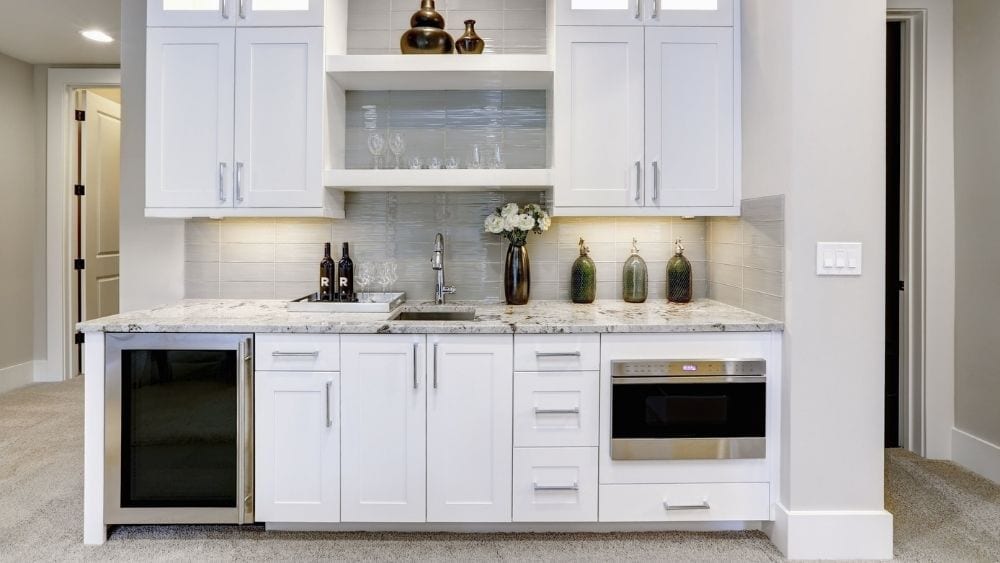 A modern in-law kitchen with a minifridge, microwave, and plenty of counterspace.