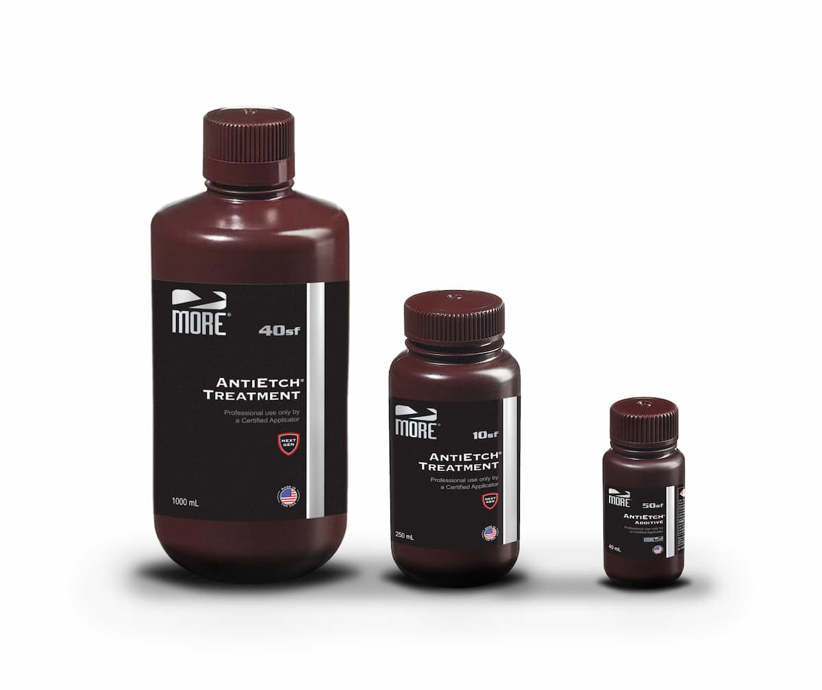 three bottles, in descending sizes, of More Surface Care stone protective treatment