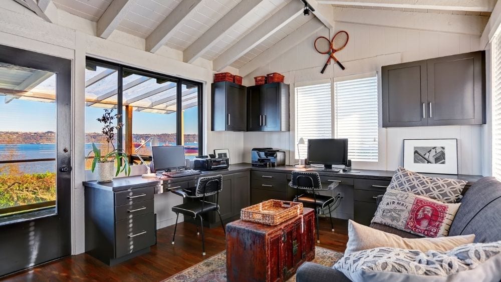 Spacious room with an l-shaped desk and two work stations.