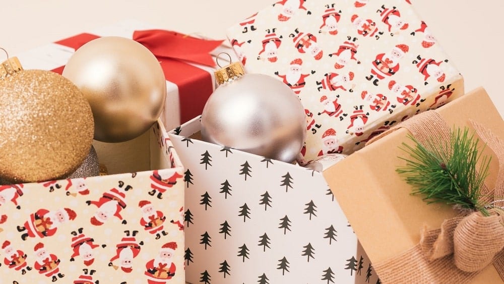 Christmas ornaments inside gift boxes.