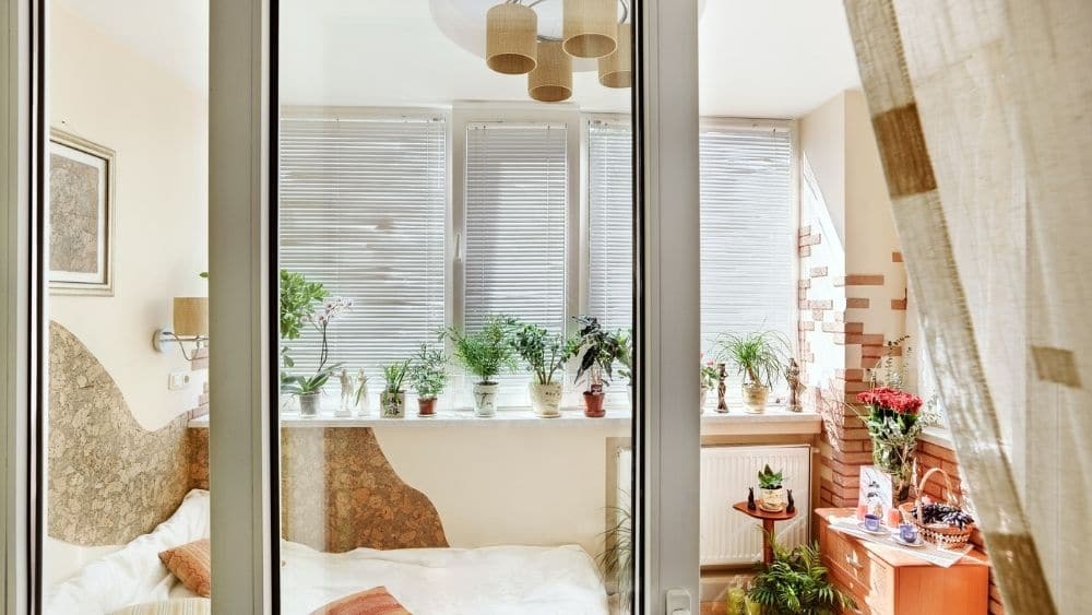 Close-up of a storm door on a bedroom.