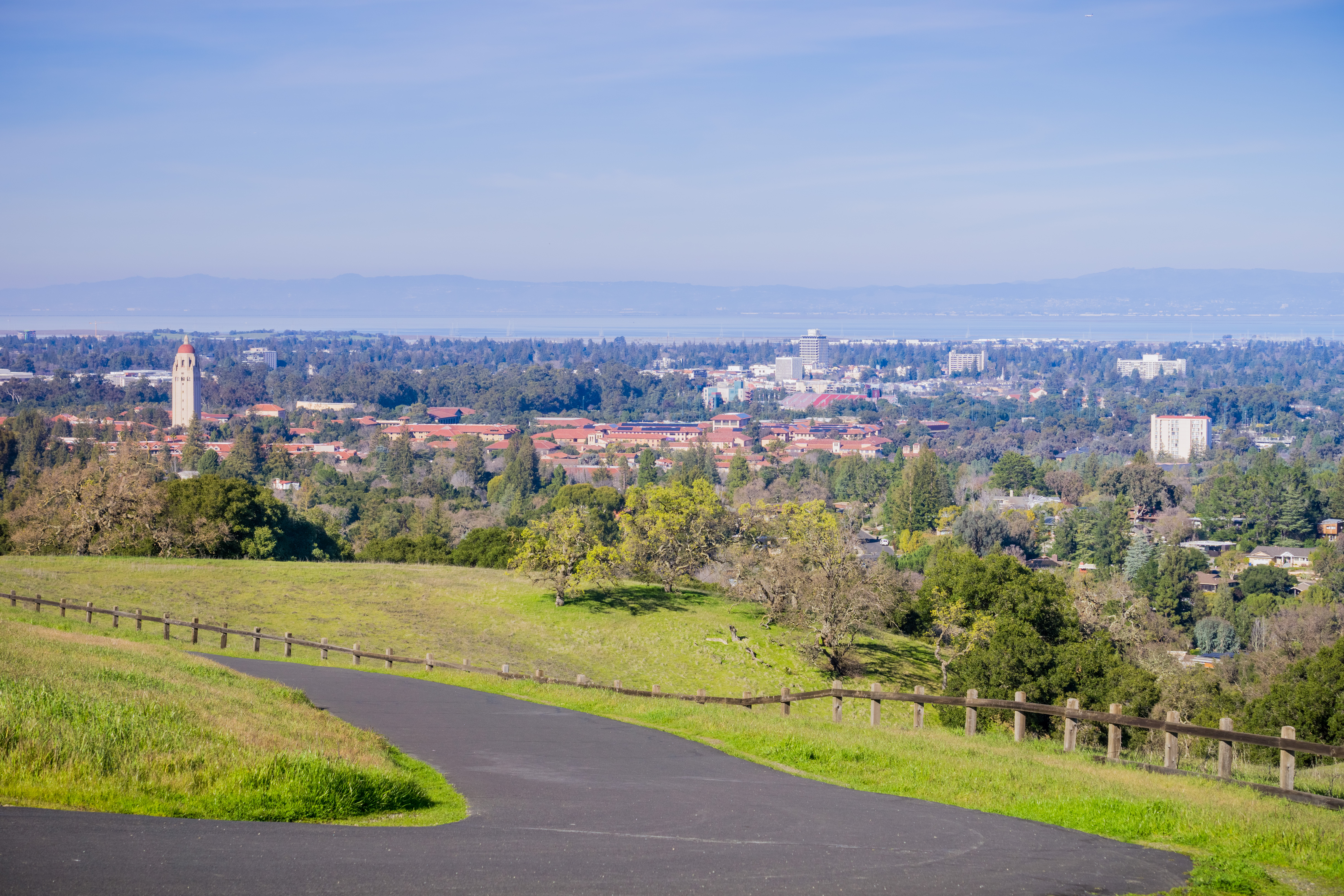 aerial view of Palo Alto and Silicon Valley skyline with a paved path in the foreground
