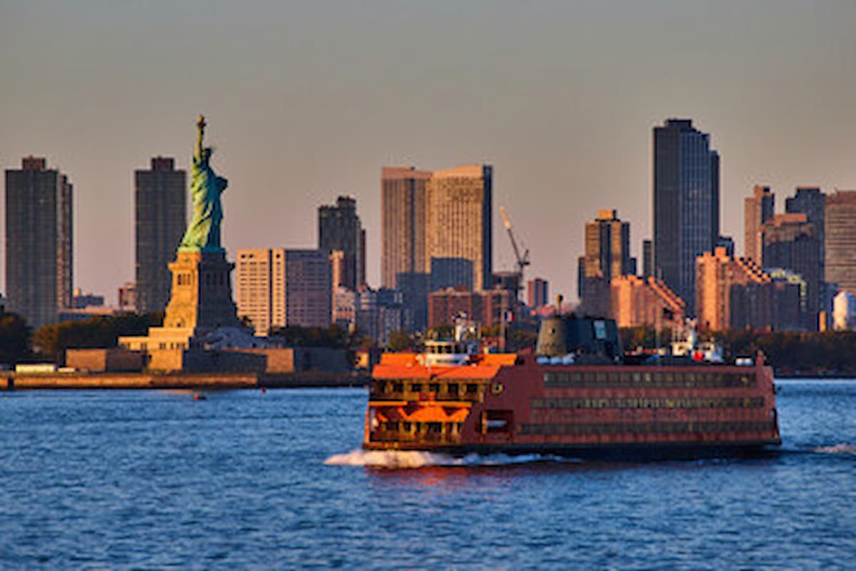 Staten Island ferry with Statue of Liberty and skyscrapers in the background