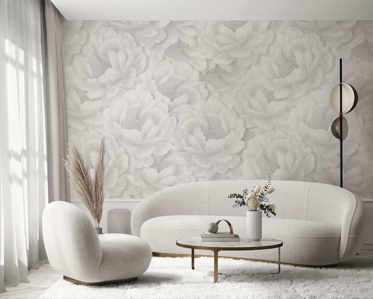 Living room with floral wallpaper, curved sofa and chair, done in Pantone's Color of the Year for 2026, Cloud Dancer