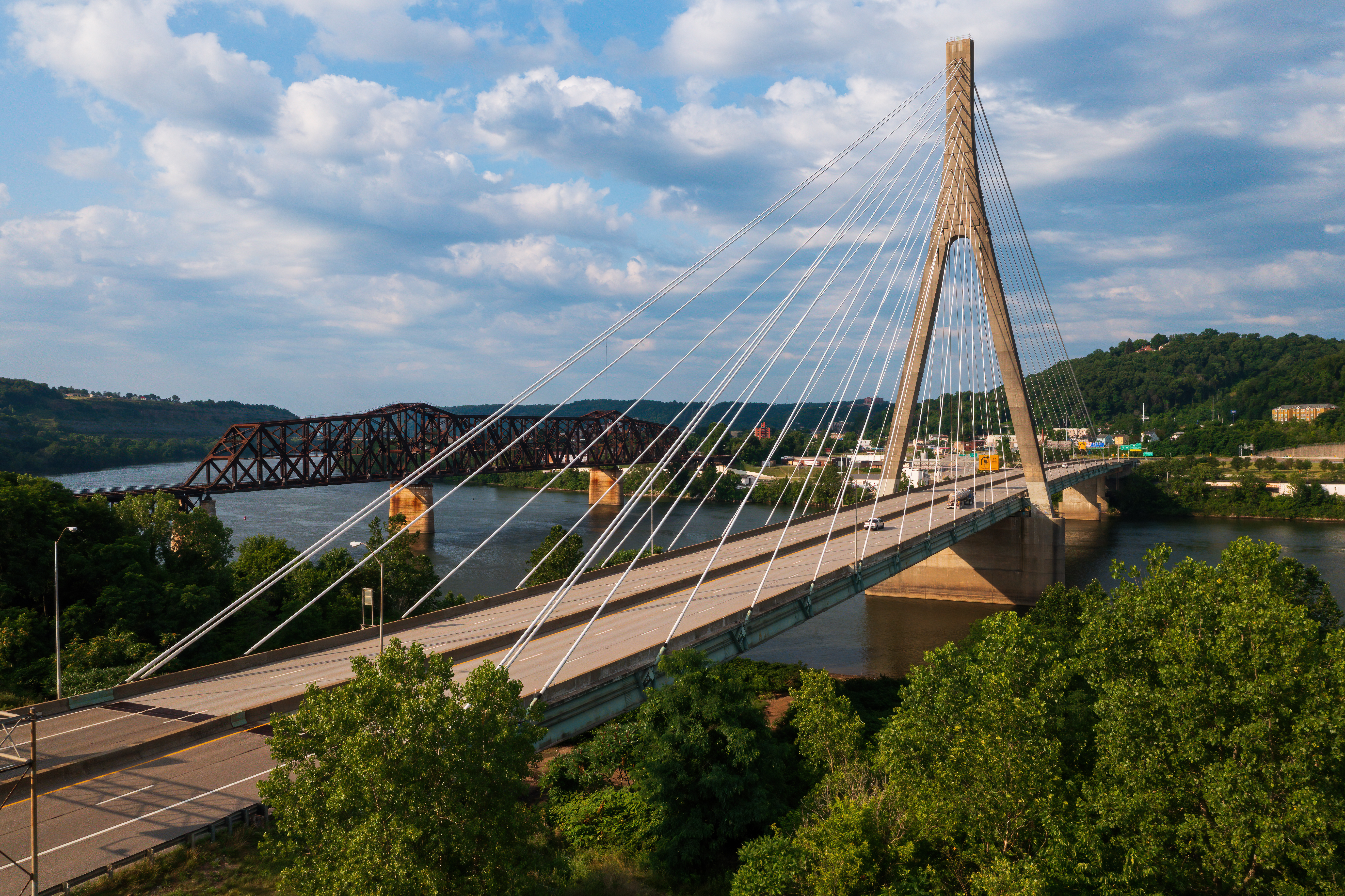 Suspension bridge over tree-lined Ohio River