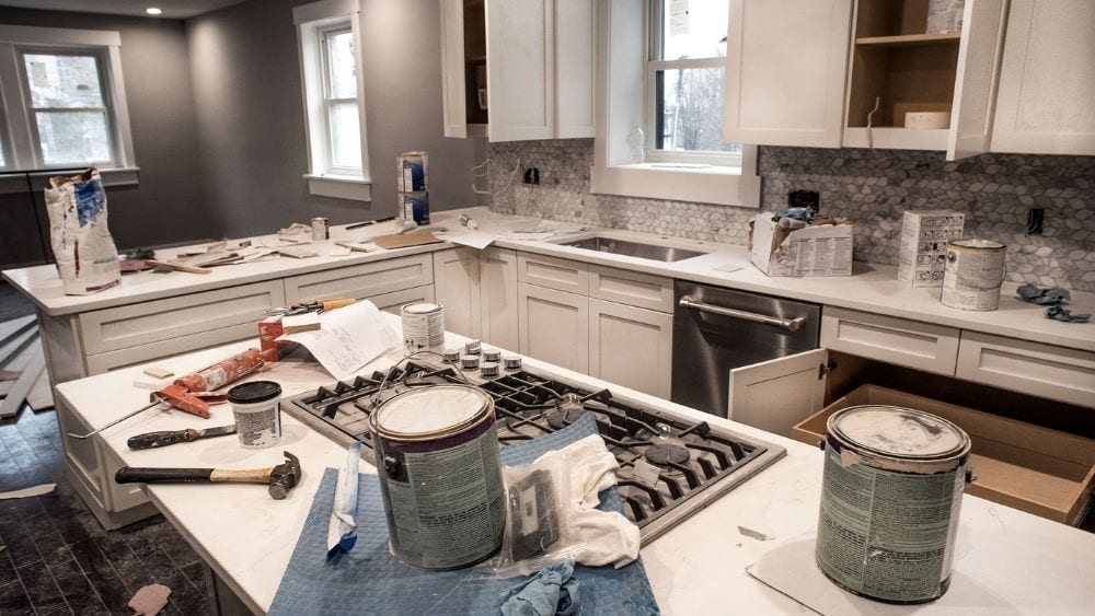 Fixer upper with tools and paint in the kitchen