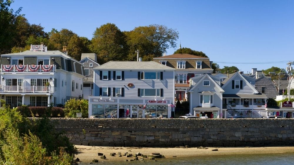 Beachfront houses behind a hurricane wall.