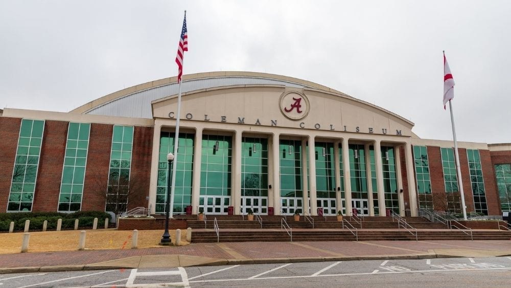 A sports colosseum with the crimson “A,” symbol of the University of Alabama.