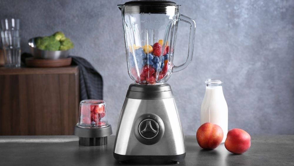 blender with fruit and milk
