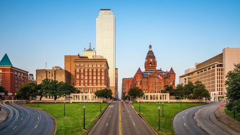 Looking down a street toward the Dallas skyline.
