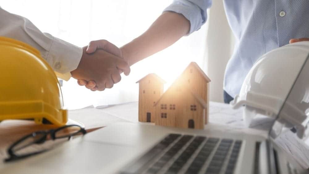 shaking-hands-over-design-plan