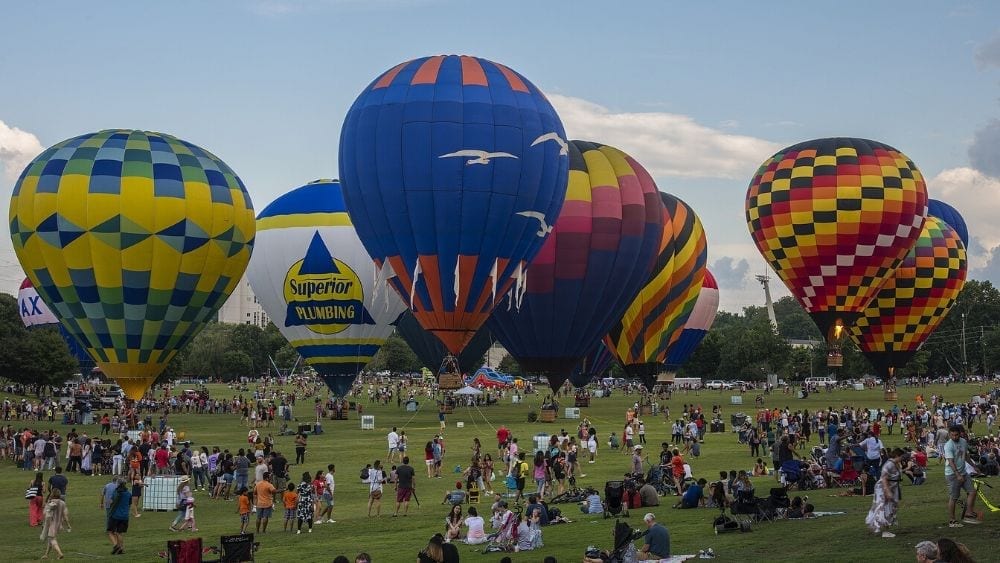 Multiple colorful balloons at a hot air balloon festival in Atlanta