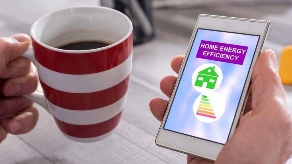 Coffee cup and phone with energy efficiency on screen